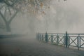 Foggy day in Ioannina with pamvotida lake covered in dense fog. Royalty Free Stock Photo