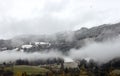 A Foggy day with view of snowfall line in a valley in Upper Austria Royalty Free Stock Photo