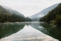 Foggy early morning on the mountain lake