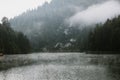 Foggy early morning on the mountain lake