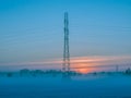 Foggy evening over snow-covered fields. Royalty Free Stock Photo