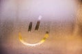 Foggy glass on window with drawn Smiley happy concept Royalty Free Stock Photo