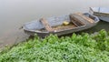 Foggy and gloomy autumn scene of boats moored along riverbank. Royalty Free Stock Photo