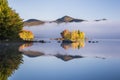 Foggy Lake and Green Mountains - Island with Colorful Trees - Autumn / Fall - Vermont Royalty Free Stock Photo