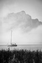 Foggy lake with lonely boat - Mondsee, Austria Royalty Free Stock Photo