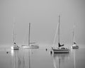 Foggy lake with lonely boats - Mondsee, Austria Royalty Free Stock Photo