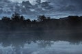 Foggy lake at night background Royalty Free Stock Photo