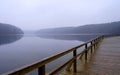 Foggy lake and pier Royalty Free Stock Photo