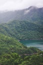 Foggy landscape by beautiful Thousand Island Lake in Taiwan, China, Asia. Lake surrounded by deep tropical forest. Moody weather. Royalty Free Stock Photo