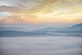 Foggy landscape forest in the morning beautiful sunrise mist cover mountain background at countryside winter Royalty Free Stock Photo