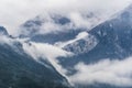 Foggy layered mountain landscape. Foggy mountains and forest. Morning valley with forest and fog view. Mystic pine Royalty Free Stock Photo