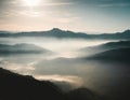 Foggy layers mountain landscape backlit