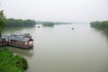 Foggy misty natural chinese landscape. Park with lake and boats near Summer Palace, Beijing Royalty Free Stock Photo