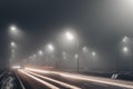 Foggy misty night road illuminated by street lights Royalty Free Stock Photo