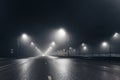 Foggy misty night road and overhead pedestrian bridge illuminated by street lights Royalty Free Stock Photo