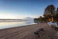 Foggy morning in lake of Algonquin Provincial Park, Ontario, Canada with benches Royalty Free Stock Photo