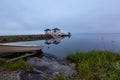 Foggy morning on the lake and boat on foreground Royalty Free Stock Photo