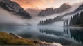 Foggy morning at the lake in Dolomites, Spectacular misty lake with snowy mountains, panorama mountains peaceful view, nature Royalty Free Stock Photo