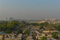 A foggy morning landscape view of city submerge of polluted city and unpolluted village