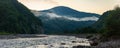 Foggy morning by the mountain river Royalty Free Stock Photo