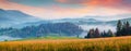 Foggy morning panorama of mountains valley. Attractive summer sunrise in Carpathian mountains, Rika village location, Transcarpath Royalty Free Stock Photo
