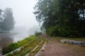 Foggy morning by the river with a path beside the treeline, Forssa Finland