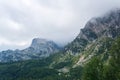 Foggy mountain landscape - wooded rocks hiding in the clouds