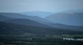 Foggy mountain layers and cabins during blue hour Royalty Free Stock Photo