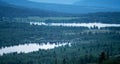 Foggy mountain layers and cabins during blue hour and sunset Royalty Free Stock Photo