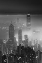 foggy night view of Victoria harbor in Hong Kong city in monochrome Royalty Free Stock Photo