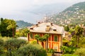 Foggy panoramic view of Ligurian coastline landscape. Graduated green mountain chains full of small towns and villages. Liguria is Royalty Free Stock Photo