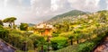 Foggy panoramic view of Ligurian coastline landscape. Graduated green mountain chains full of small towns and villages. Liguria is Royalty Free Stock Photo