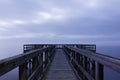 Foggy Pier Stretching into the Distance Royalty Free Stock Photo