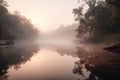 a foggy river with trees in the distance and a few mists on the water