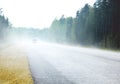 THE FOGGY ROAD WITH CAR Royalty Free Stock Photo