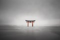 Foggy shot of the floating torii of Miyajima, Japan during rain