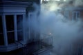 foggy smoke emerging from a rooftop window Royalty Free Stock Photo