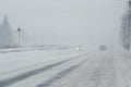 Foggy, snowed road with low visbility