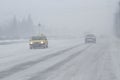 Foggy, snowed road with low visbility