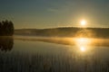 Foggy sunrise on the forest lake. August morning. Finland Royalty Free Stock Photo