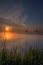 Foggy sunrise with mill in background Royalty Free Stock Photo