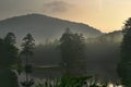 Foggy Sunrise on Mountain Lake Royalty Free Stock Photo