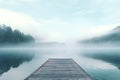 Foggy sunrise near the lake. Misty lake in the early morning. fog in the morning forest. The wooden bridge is a foreground. Royalty Free Stock Photo
