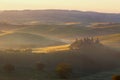 Foggy sunrise over the rural house with vineyards in San Quirico d'Orcia Royalty Free Stock Photo