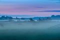 Foggy sunrise over the Sassenheim meadows along the Kagerplassen. Royalty Free Stock Photo