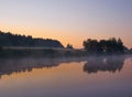 Foggy sunrise on river