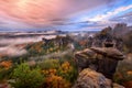 Foggy sunrise in the Saxon Switzerland, Germany, view from the Bastei lookout point. Royalty Free Stock Photo