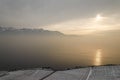 A foggy sunset on the Leman lake Royalty Free Stock Photo