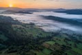 Foggy sunset in Polish mountains Silesian Beskid.