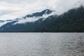 Foggy Teletskoye lake in Altai mountains